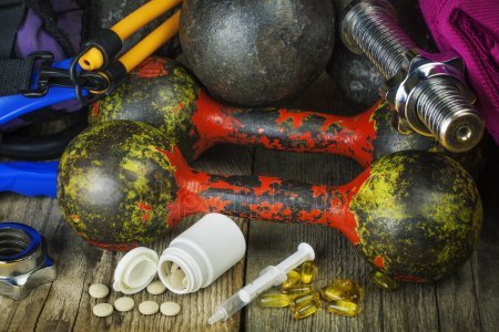 depositphotos_38503275-stock-photo-dumbbells-sports-gear-with-pills.jpg.89cea74643dd91796965c41b92f1a2c8.jpg